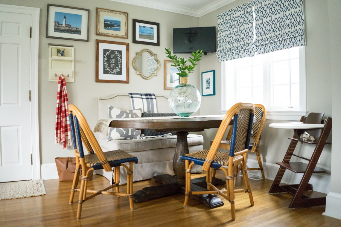 A dining room table with four chairs in it