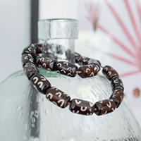 Close up image of a bracelet on a bottle