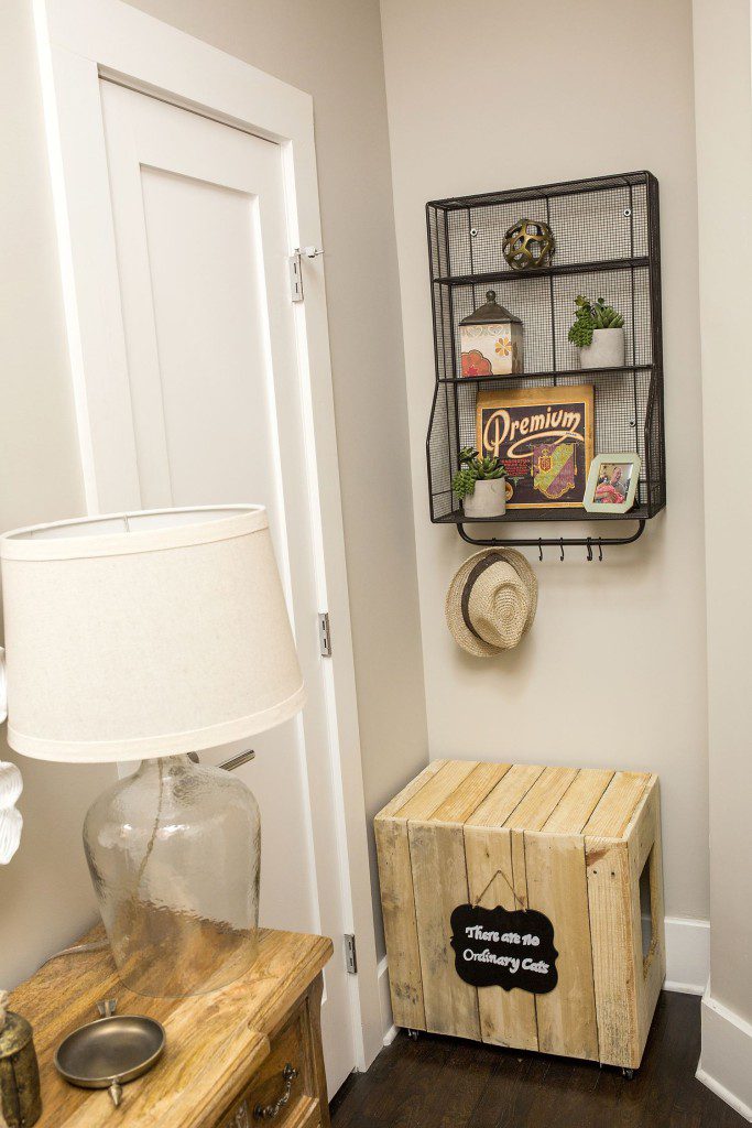 A room with a wooden crate and a lamp