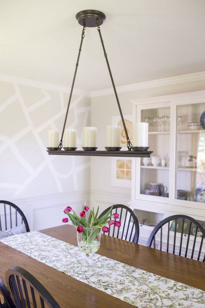 A dining room table with candles on it