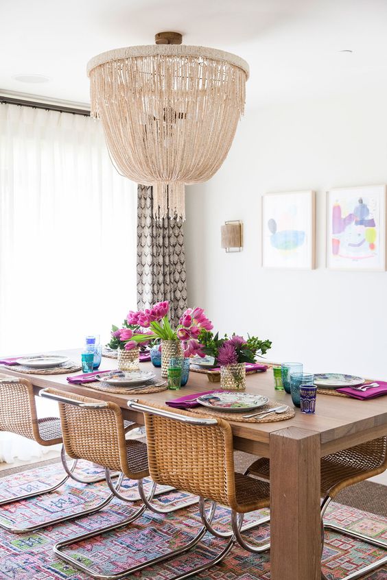 A dining room table with plates and napkins on it