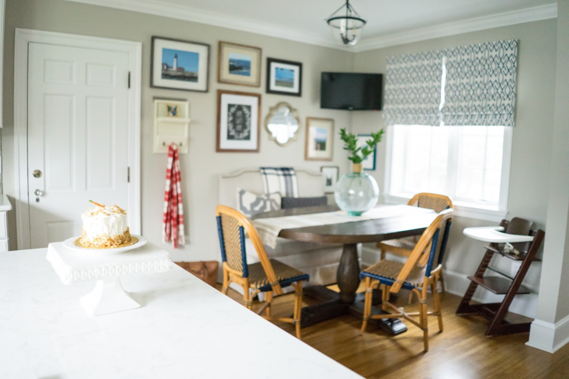 A dining room with a table and chairs in it