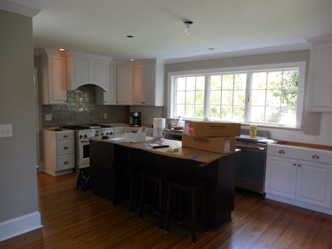 A kitchen with a lot of counter space and boxes