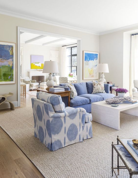 A living room with blue and white furniture